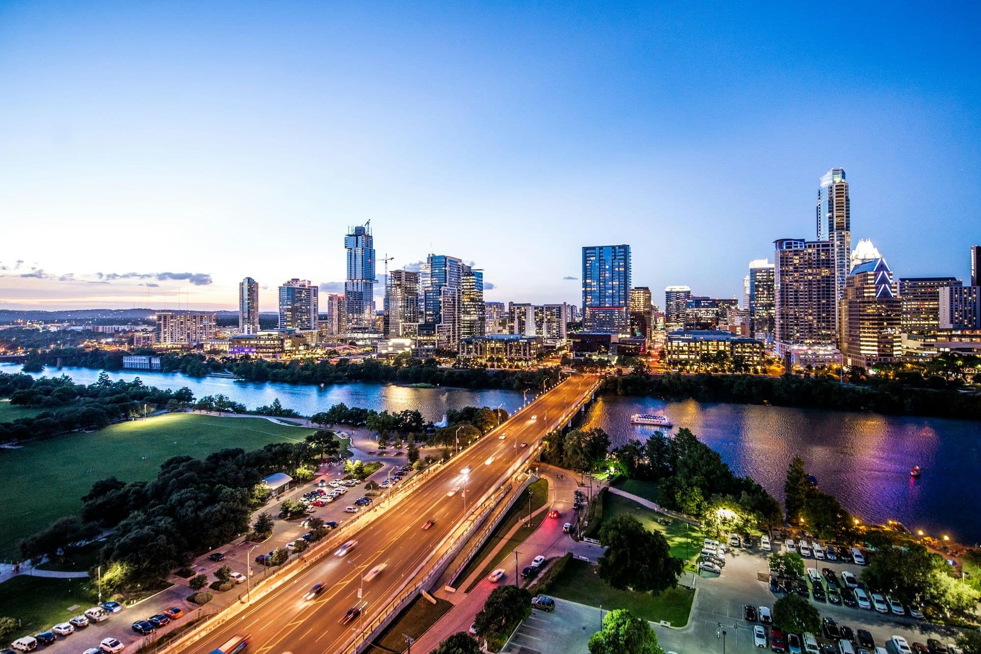 Downtown Austin skyline above Lady Bird Lake at dusk