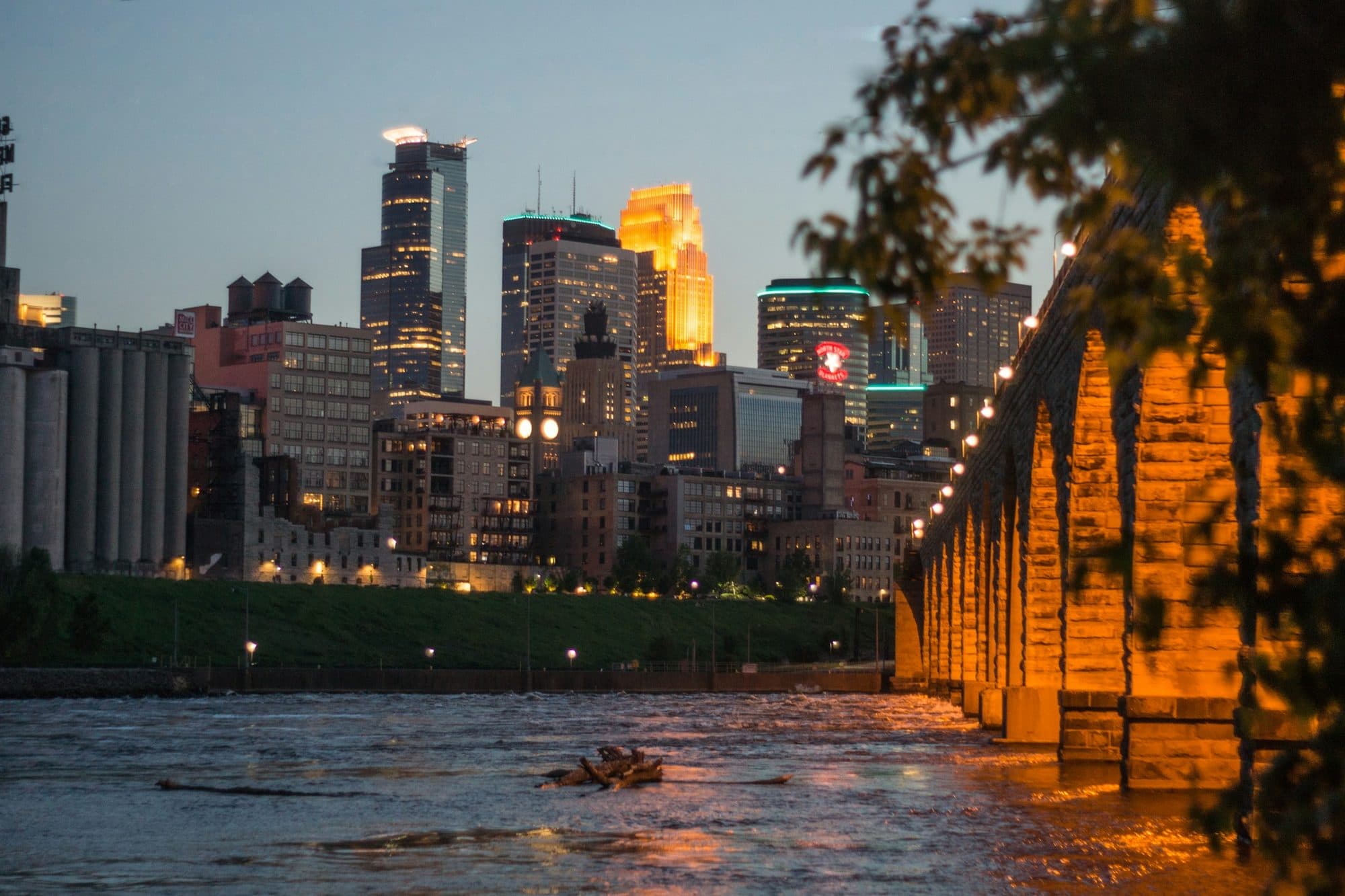 The Stone Arch Bridge and Minneapolis skyline at golden hour