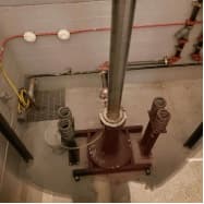 Eddy leak sensor location in an elevator pit