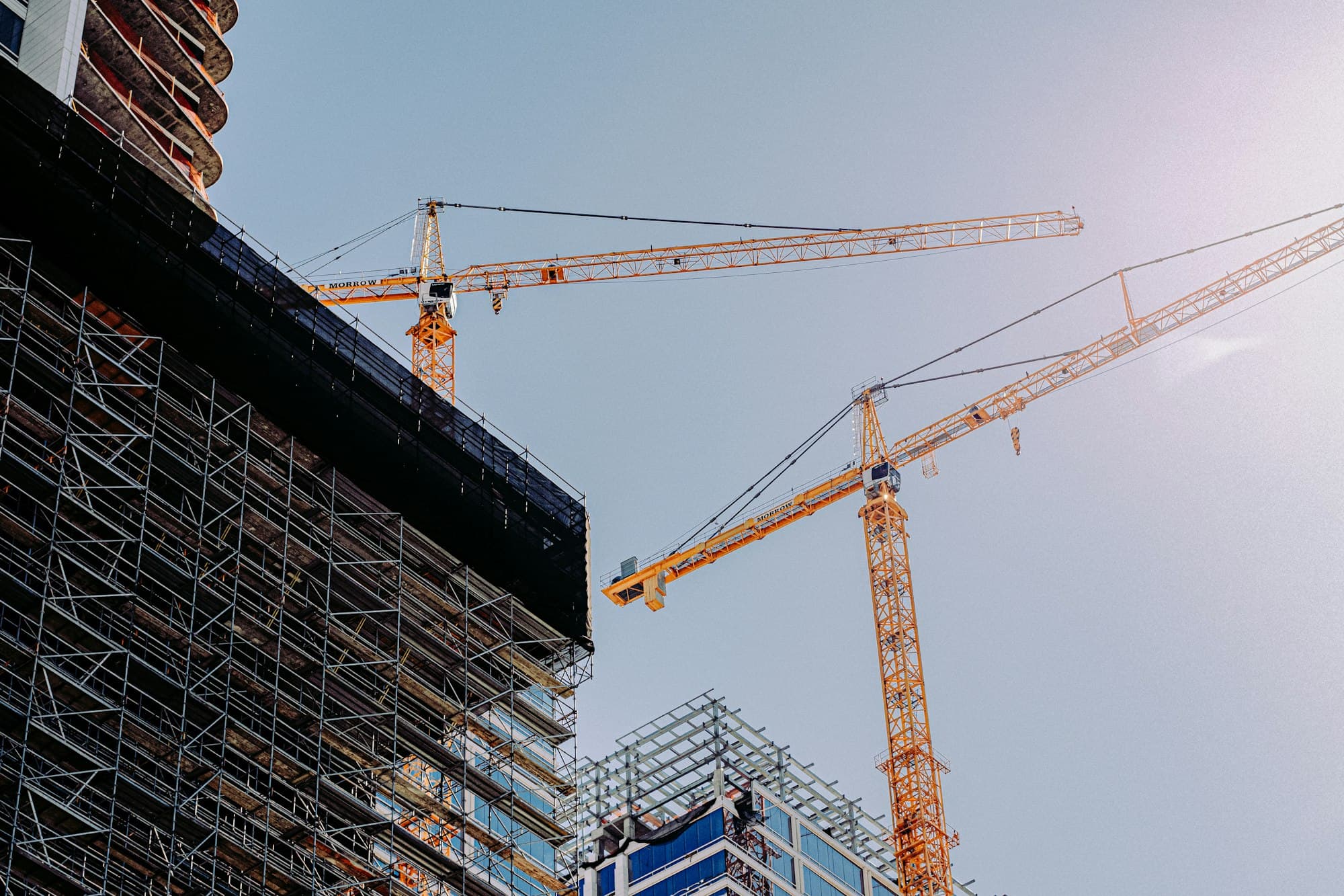 High-rise under construction with tower cranes