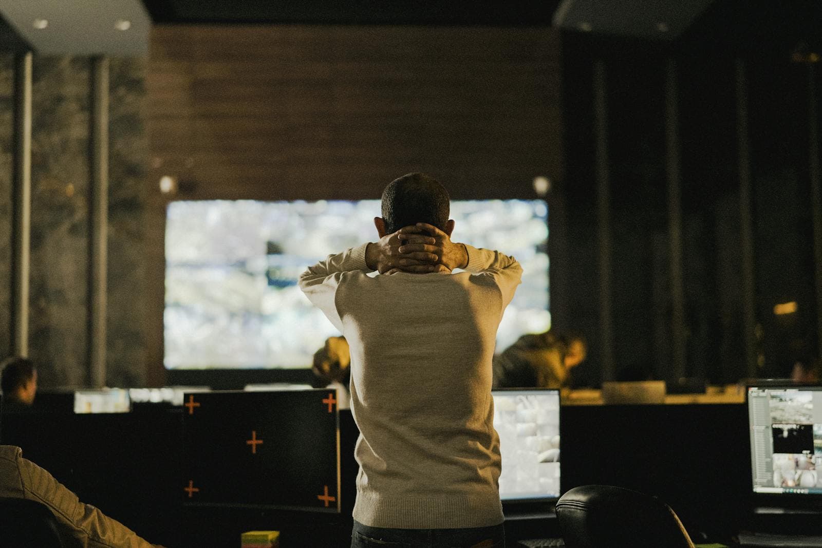 An operator watching live monitoring screens around the clock