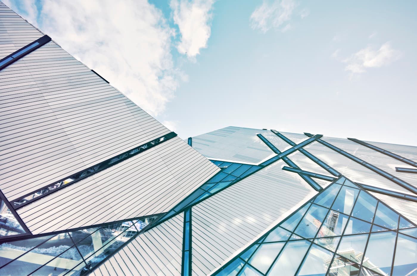Stacked tenant floors of a glass office tower seen from below