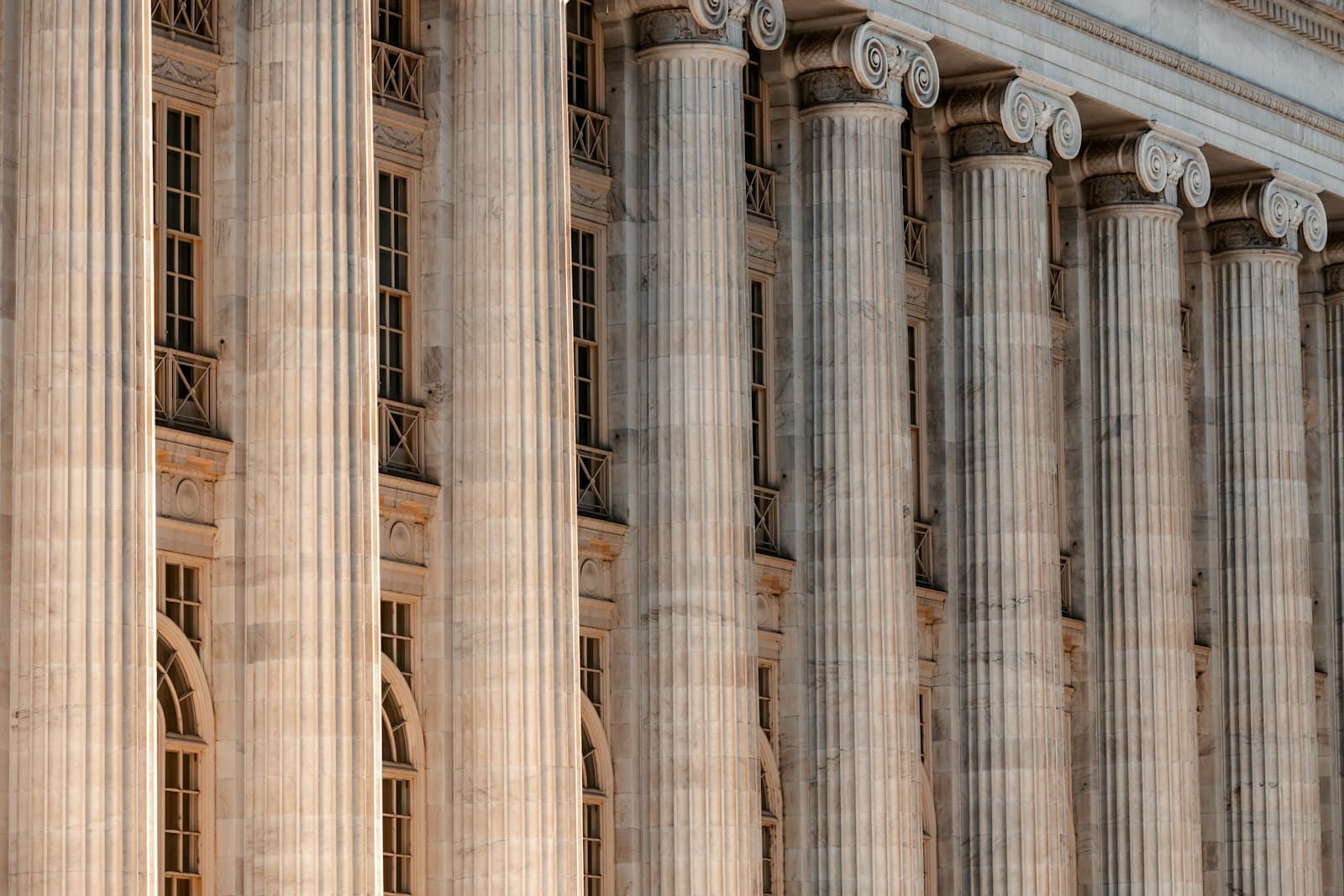Classical civic building with a tall stone colonnade.