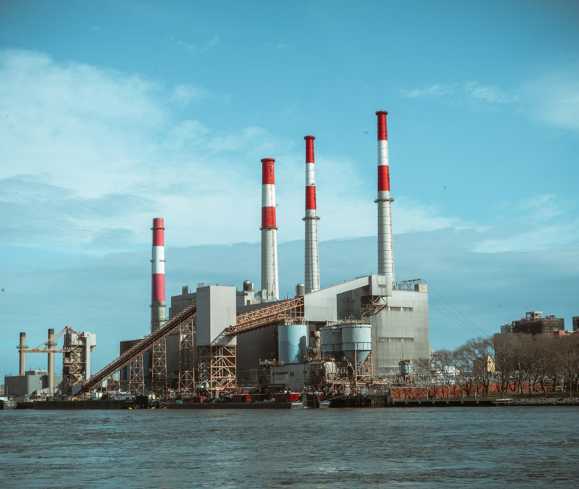 Large industrial plant beside the water.