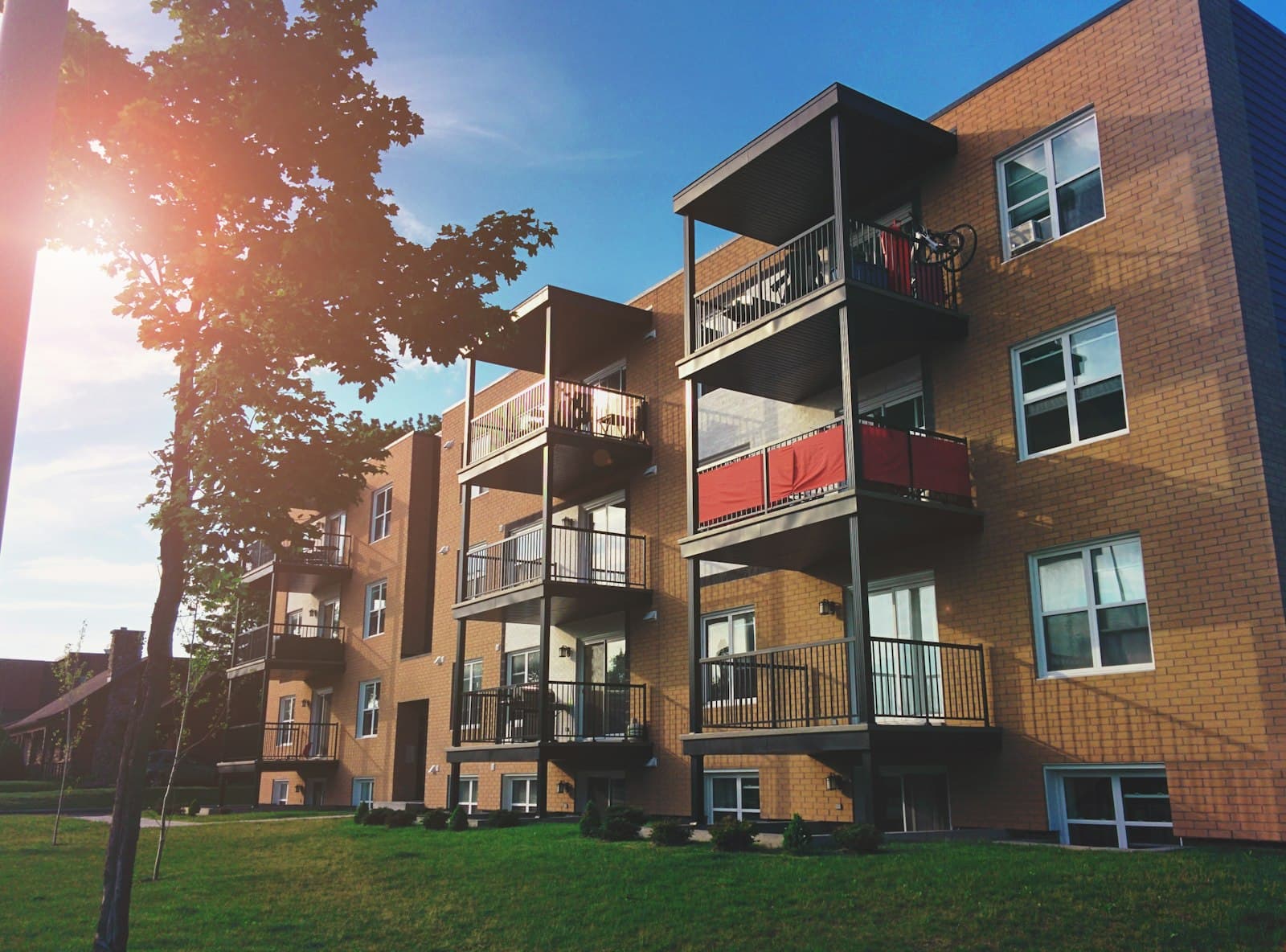 Low-rise apartment building with private balconies.