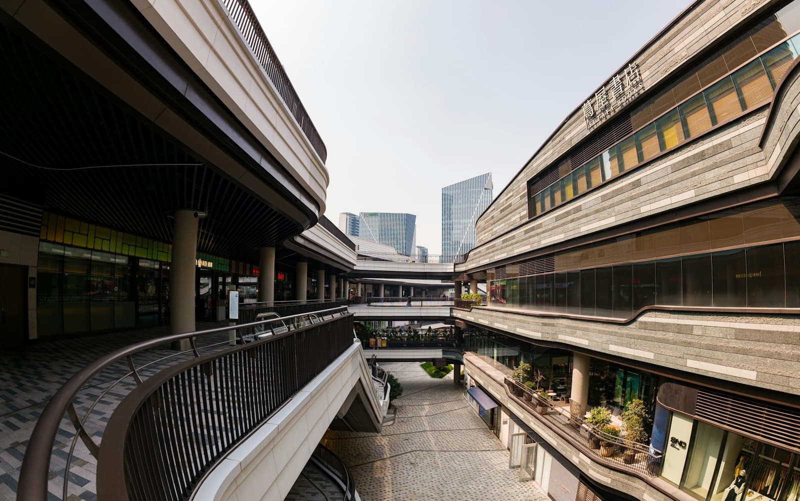 Multi-level modern retail center with open walkways.