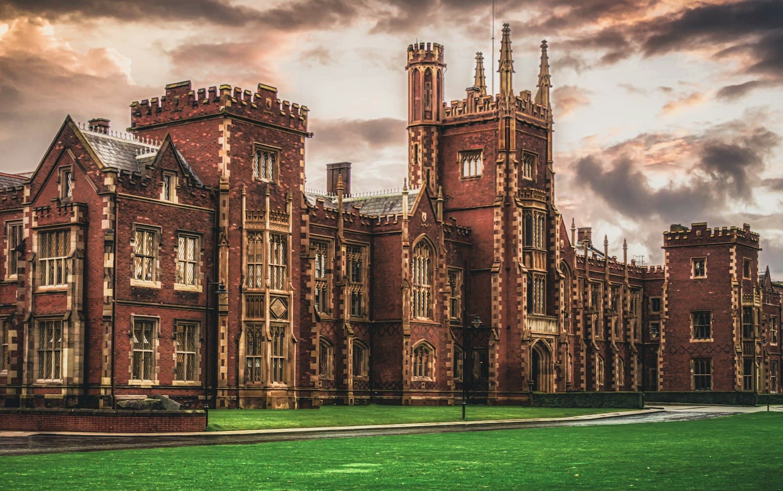 Brick and stone campus building at dusk.