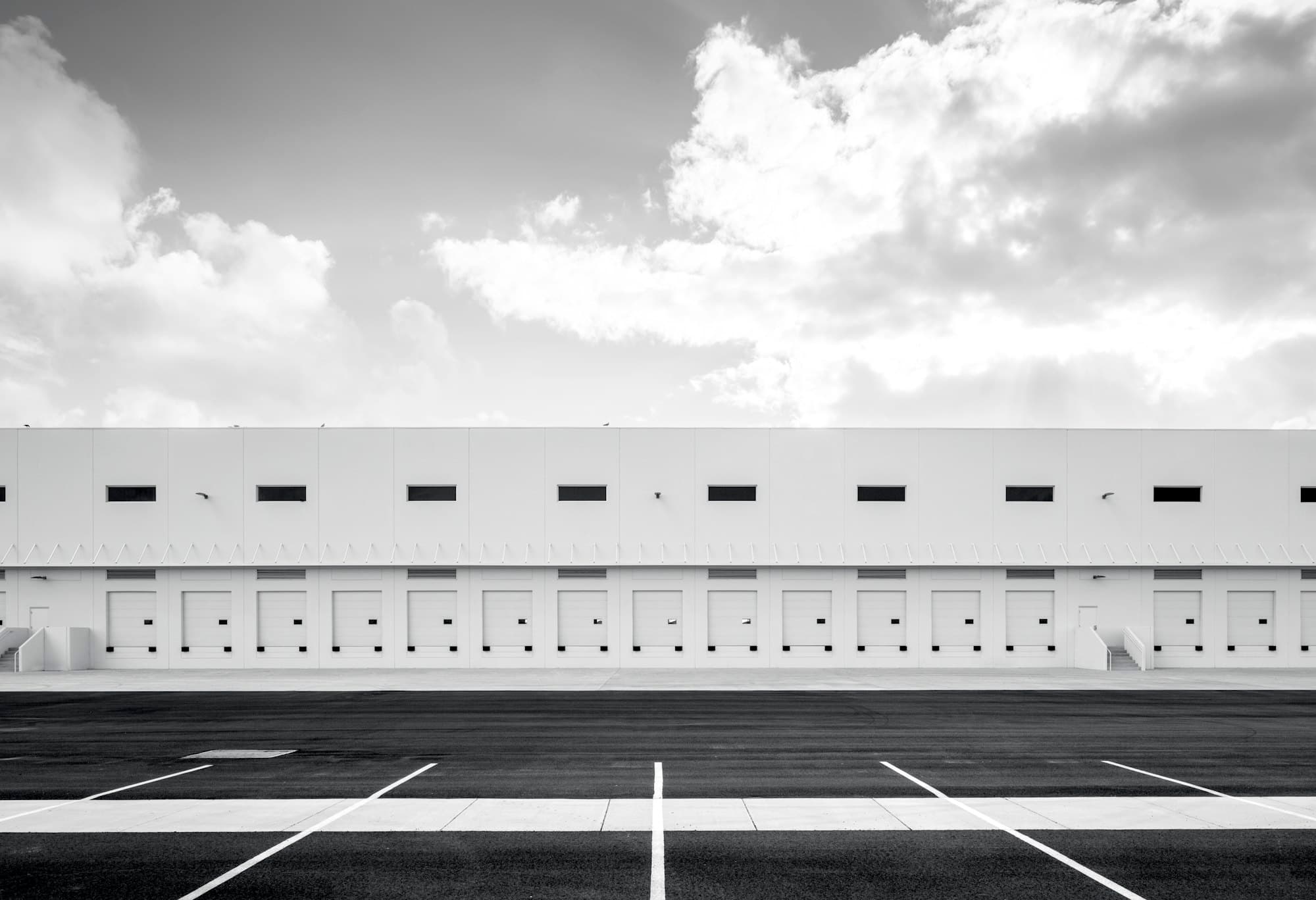 Modern distribution warehouse with a row of loading docks.